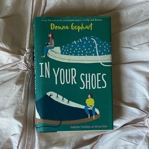 In Your Shoes Hardcover Book by Donna Gephart